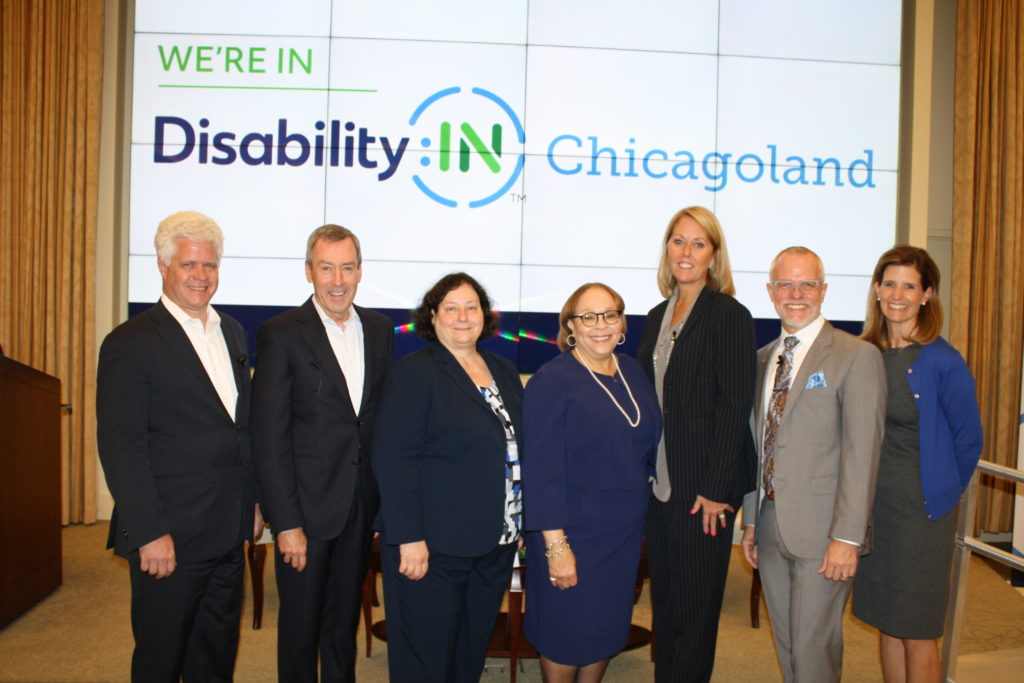 Northern Trust representatives MacMacLellan, Nancy Nauheimer & Connie Lindsey stand with Jill Houghts, Disability:IN CEO