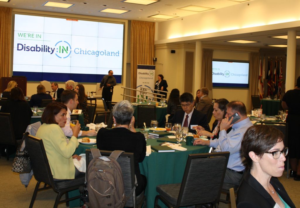 Event attendees wait for the panel discussion to begin