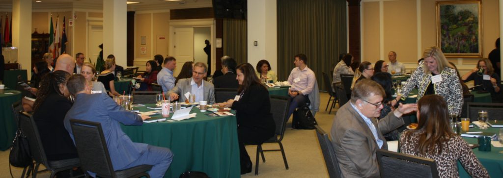 Event attendees eat breakfast before the event begins