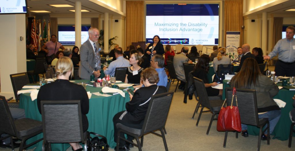 Panel moderator Scott Hoesman talks with attendees before the session begins