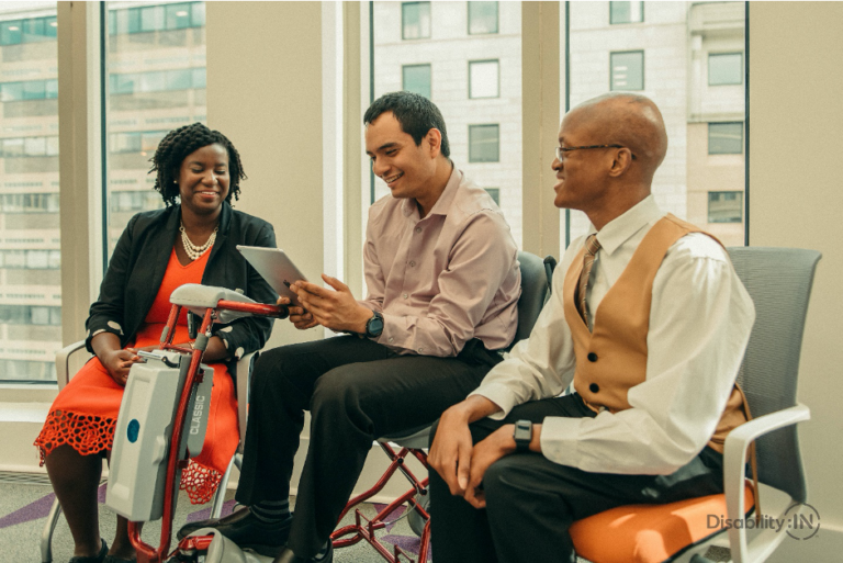 diverse group of people talk in meeting room
