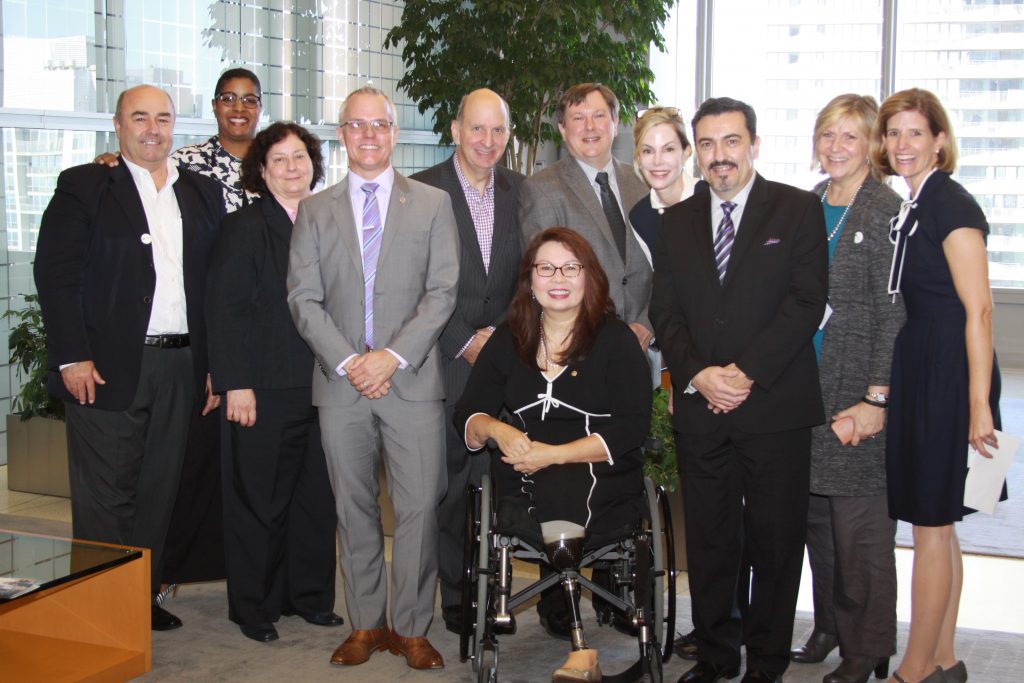 Disability:IN Chicagoland Board Members & staff pose with Senator Tammy Duckworth