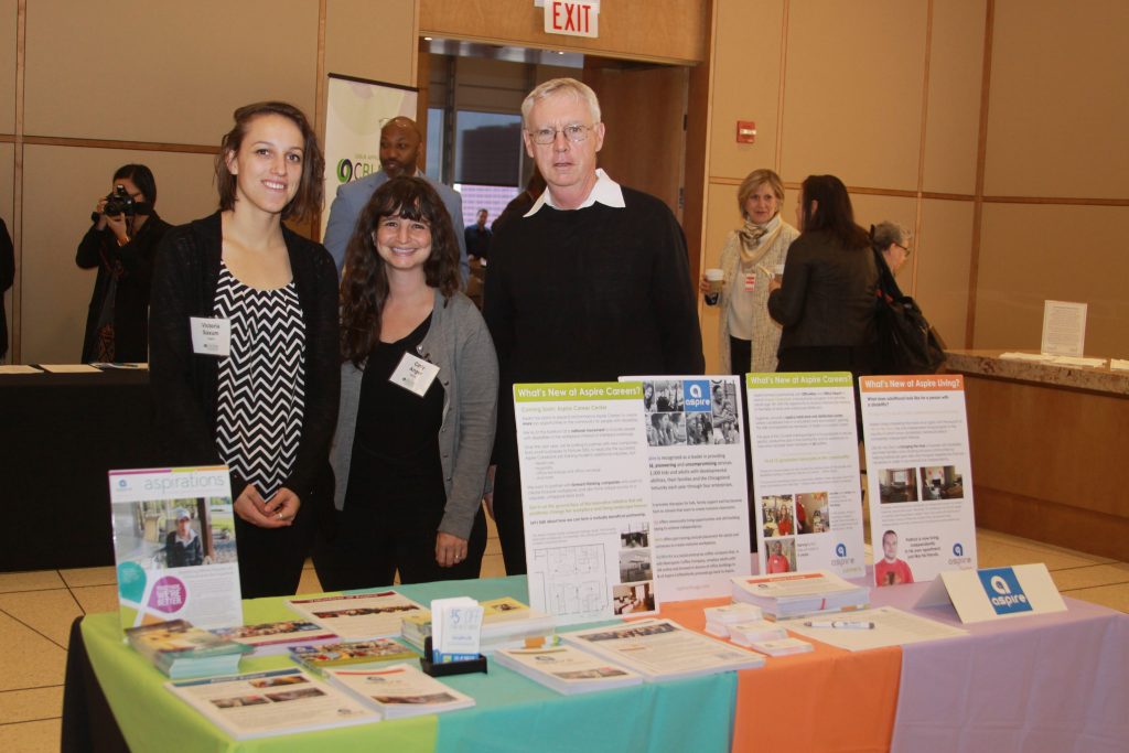 Members of the Aspire team host an exhibitor table at the Disability Inclusion Opportunity Summit