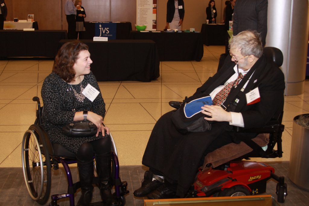Bridget Hayman and Gary Bensinger, both wheelchair users, talk at the Disability Inclusion Opportunity Summit